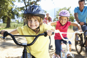 Young family on country bike ride